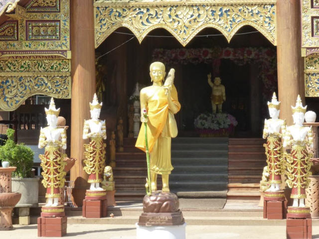 Standing god sculpture golden