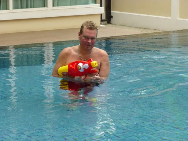 Chiang Mai Stefan in pool with water gun
