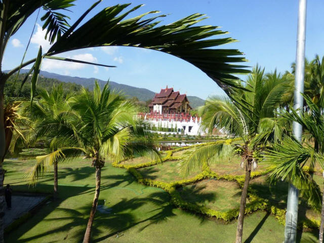 Temple in background and palm trees in foreground