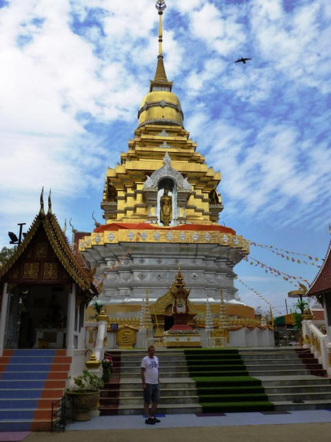 Thailand Chiang Mai temple with golden roof and Stefan in front
