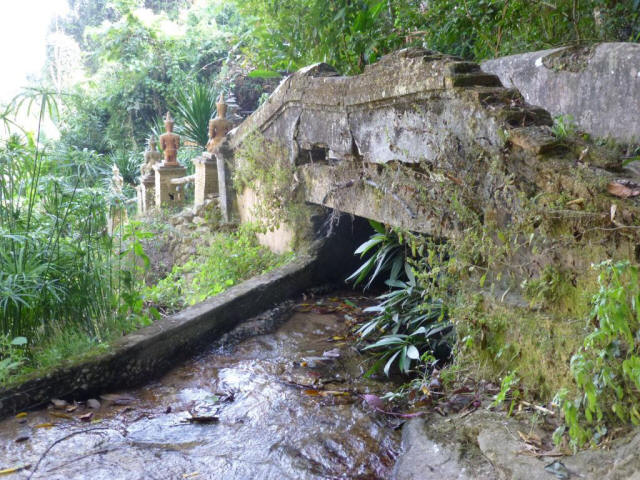 Very old bridge with little water flow underneath it