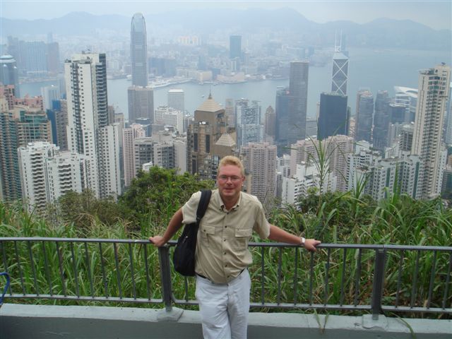 Hong Kong Stefan on hill in front of skyline