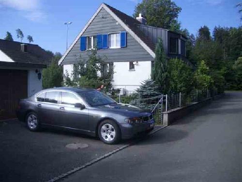 House Suhr Garage and house with car in driveway from side