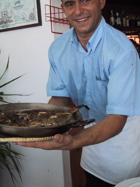 Restaurant Ibiza Spain Waiter with hot seafood