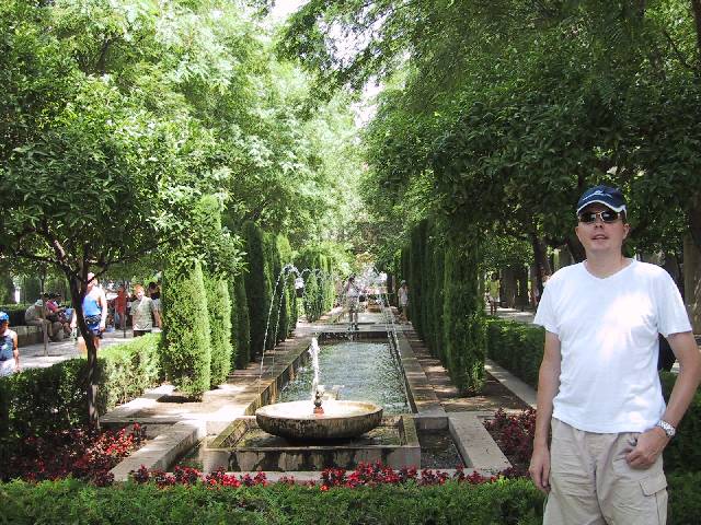 Palma de Mallorca LEPA Beat next to water fountain in garden at Cathedral