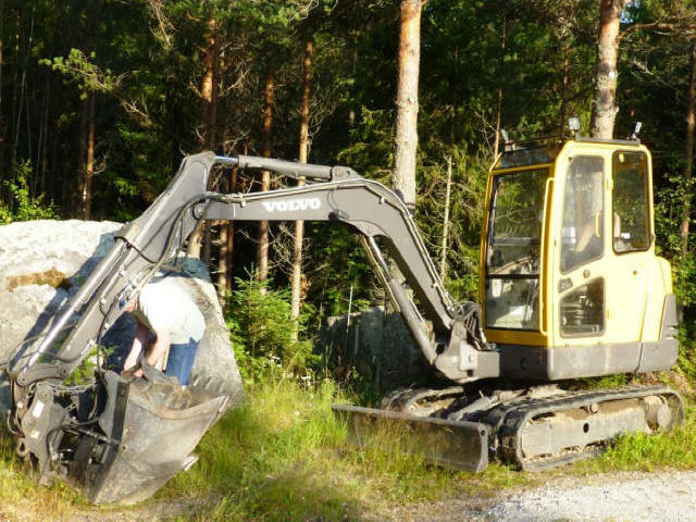 Stuga Digger next to stone