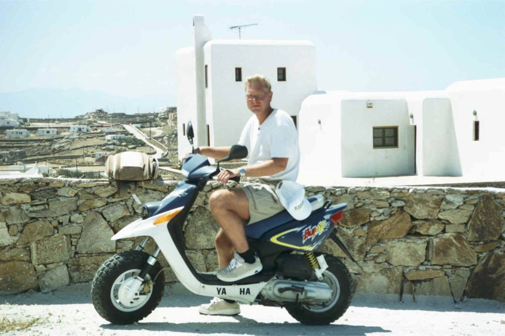 Mykonos Stefan sitting on motorbike  